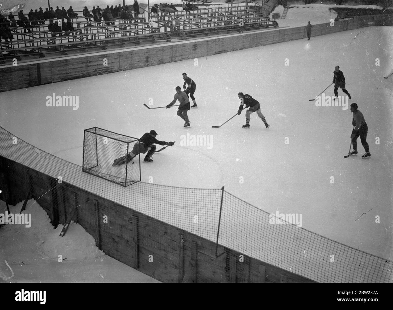 London team beaten in St Moritz ice hockey. A London team was beaten seven goals to nil by St Moritz team in the contest at the annual St Moritz trophy at the Swiss resort. Photo shows, play round one of the goals dreamy ice hockey match at St Moritz. 1 January 1938 Stock Photo