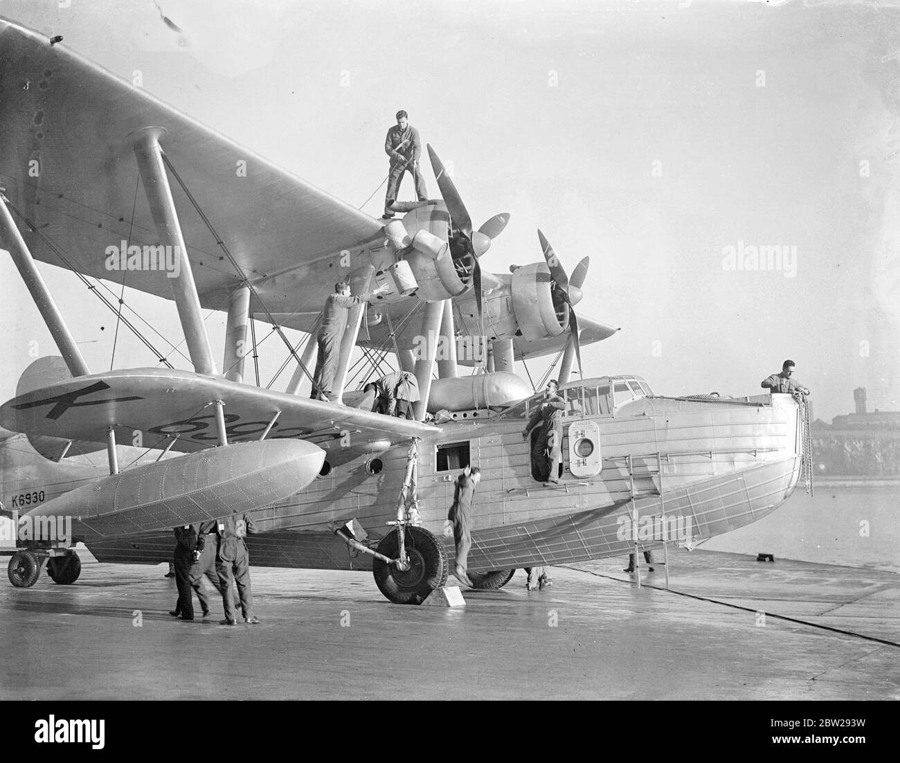 The longest formation flight ever undertaken by service unit, five RAF Saro London flying boats of number 204 (Gen reconnaissance) Squadron being prepared at Plymouth. They will take off next week and by the time I return in the Spring, they would have flown 25,000 miles to Australia and back. The visit is being made in connection with the 150th anniversary celebration of Sydney. Photo shows, refuelling one of the flying boats at Plymouth. 26 November 1937 Stock Photo