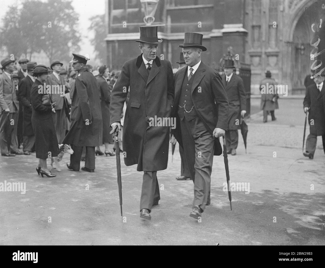 Lord Halifax and Sir Thomas Inskip at funeral of Lord Rutherford. The ashes of Lord Rutherford, the eminent scientist, were buried in Westminster Abbey. The funeral was attended by statesman as well as leading scientists. Photo shows, Lord Halifax, Lord President of the Council (left), and Sir Thomas Inskip, Defence Minister, leaving after the funeral. 25 October 1937 Stock Photo