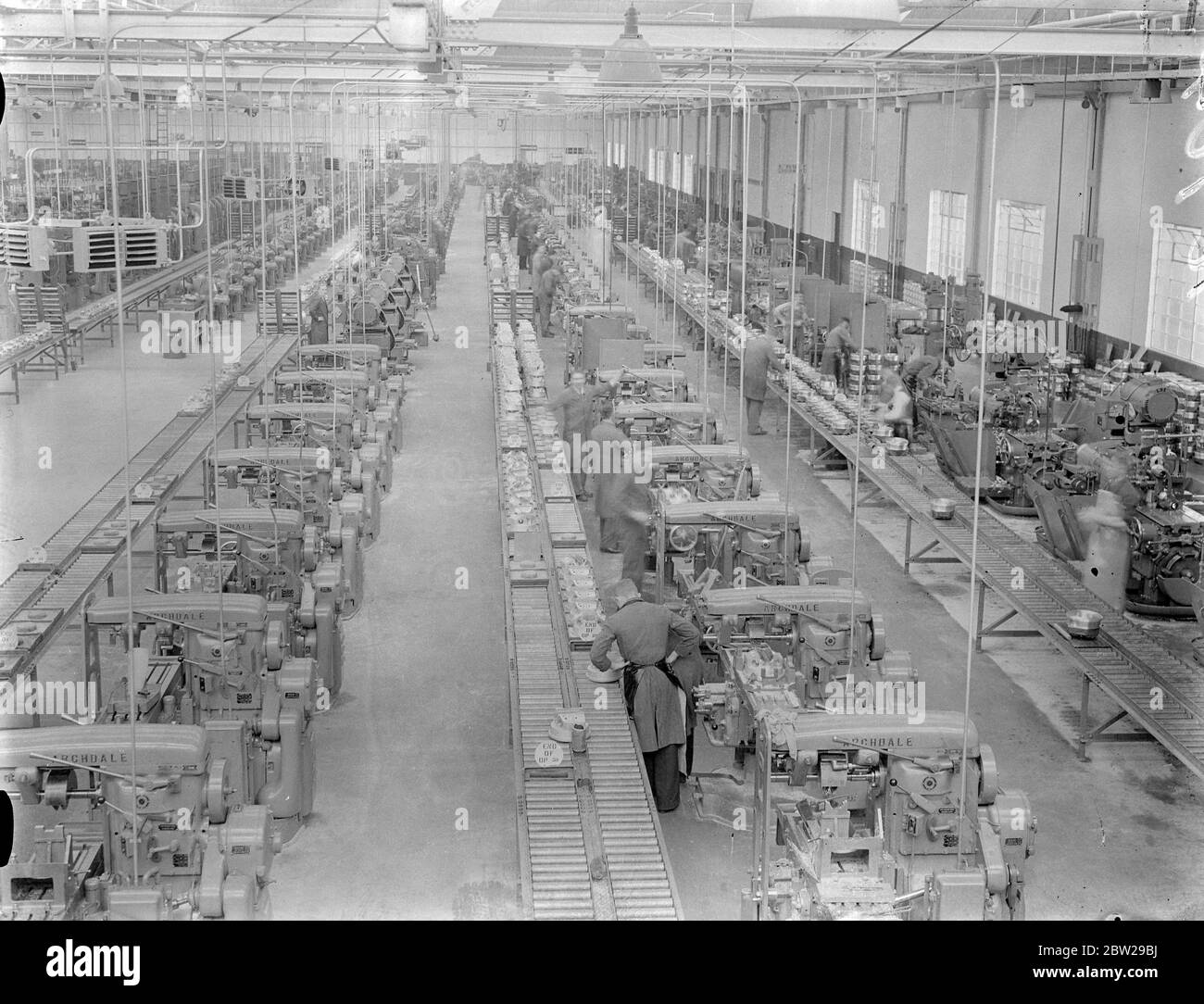 'Shadow factories'silent allies of Britain's Air Force. This series of pictures is the first ever made in Britain's 'shadow factories'the centres organised among motor manufacturers throughout the country to aid the Royal Air Force expansion scheme. Less than a year ago the 'shadow factories'were only an idea, but now high-speed work has established buildings on Marstons and given a valuable ally to the aircraft industry. Photo shows, a general view of the aero engine assembly shop at the standard 'shadow'factory at Coventry. 26 October 1937 Stock Photo
