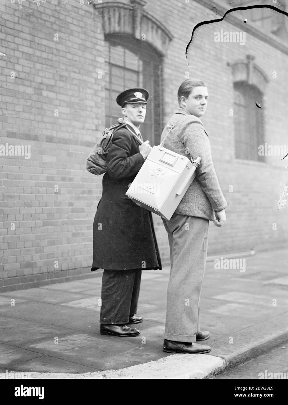 Public schoolboys learn to be gas fitters in London. Boys from famous public schools and the universities are fixing gas meters and gas fires in the homes and shops of 8 million users throughout London and from Windsor to Southend. The boys are trained at Watson House, Fulham, which is the gas equivalent to Hendon training college for young police officers. At present boys from Magdalen College School, Oxford, Shrewsbury, Christ Hospital, Haileybury and Merchant Taylors School are receiving training as Gassman. It is considered that the contact between gas employees and the public has now so m Stock Photo