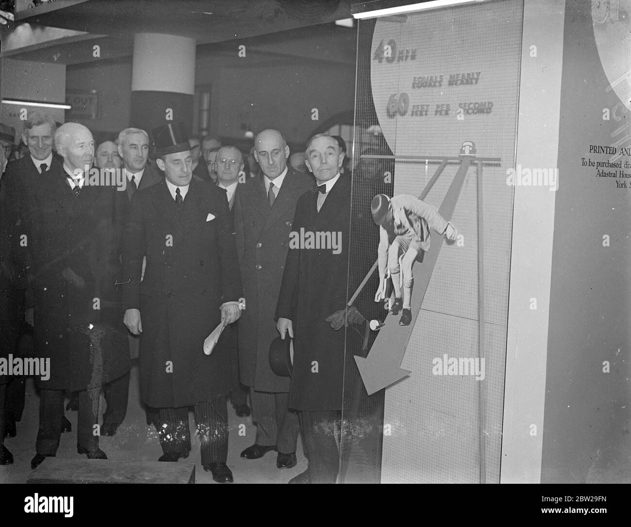 Minister of transport, and police chiefs at opening of 'Highway Code ' exhibition. The Minister of transport, Mr Leslie Burgin, open the Ministry of Transport Exhibition 'The Highway Code at Charing Cross Underground station. The exhibition is tended to focus the attention of the public on the necessity for strict observance of the provisions of the Highway Code. If the normal increase in road accidents at this time of the year is to be avoided. Photo shows, left to right, Lord Ashfield, head of London transport, Mr Leslie Burgin, the Transport Minister, Sir Hugh Turnbull, City Police Commissi Stock Photo