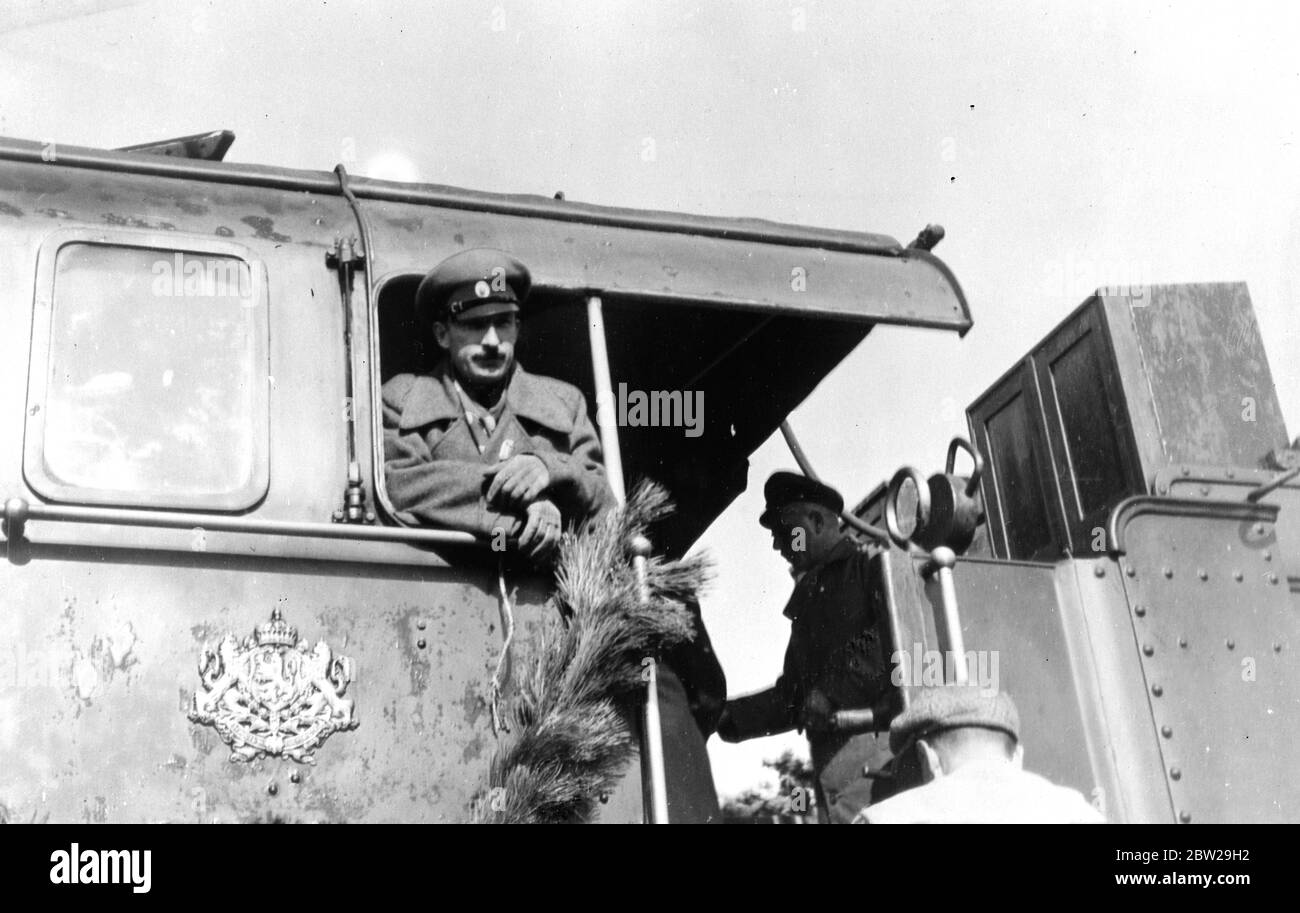 King Boris drives first train of a new Bulgarian railway line. King Boris of Bulgaria, the best-known amateur engine driver in the world, again took the footplate when he drove the first train over Bulgaria's important new railway line linking Sofia, with the Mediterranean. 19 October 1937 Stock Photo