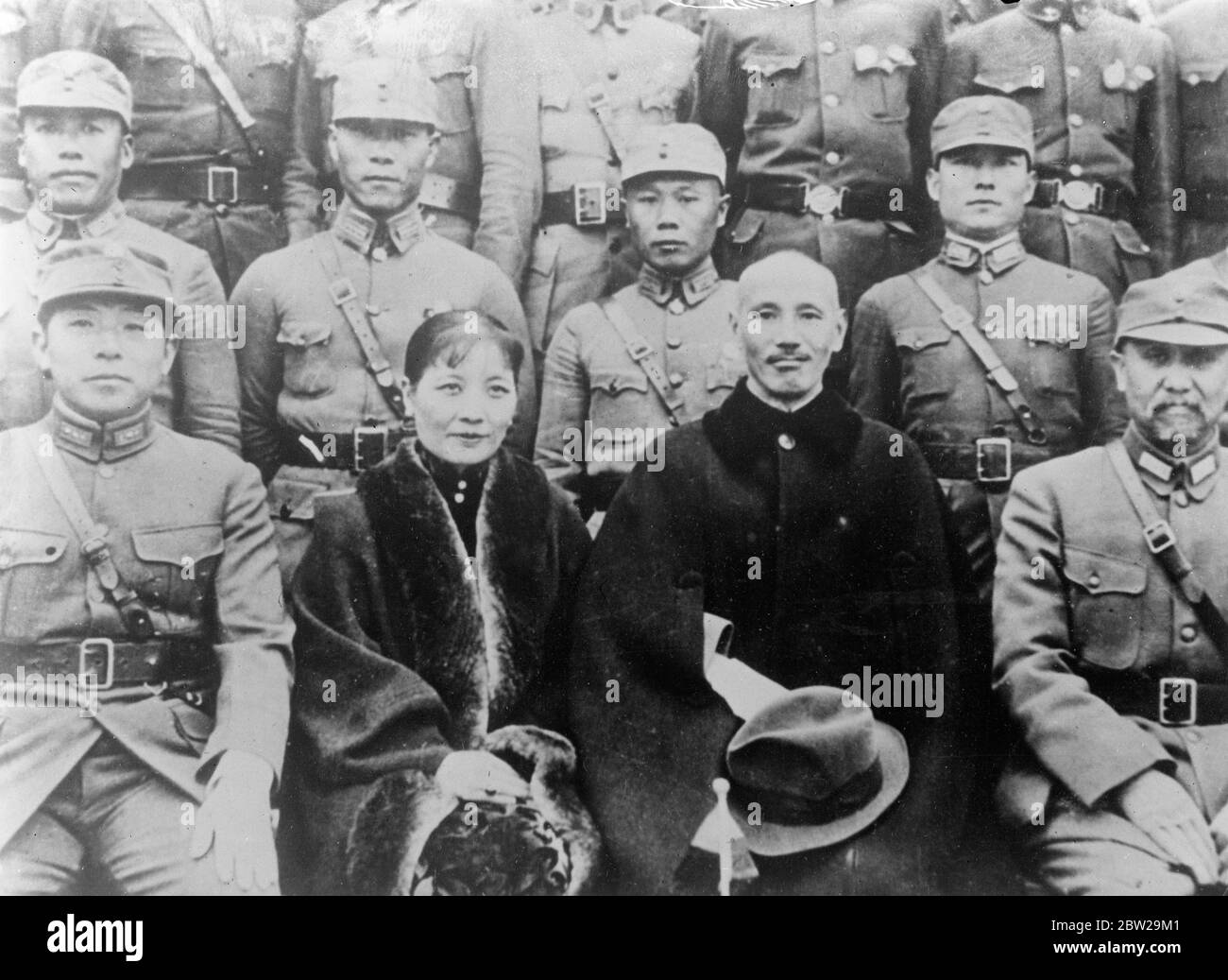 General Chiang Kai Shek leaves Nanking. With the Japanese about to make their final assault on Nanking, the Chinese Capital, General Chiang Kai Shak, the Chinese commander-in-chief, has left the city. It is believed that he has gone to Nanchang, capital of the Kiangsi province. Mme Chiang, wife of the General, has been beside her husband throughout the Japanese advance on Nanking. Photo shows, a new picture of General Chiang Kai Shak and his wife, taken in Nanking. 7 December 1937 Stock Photo