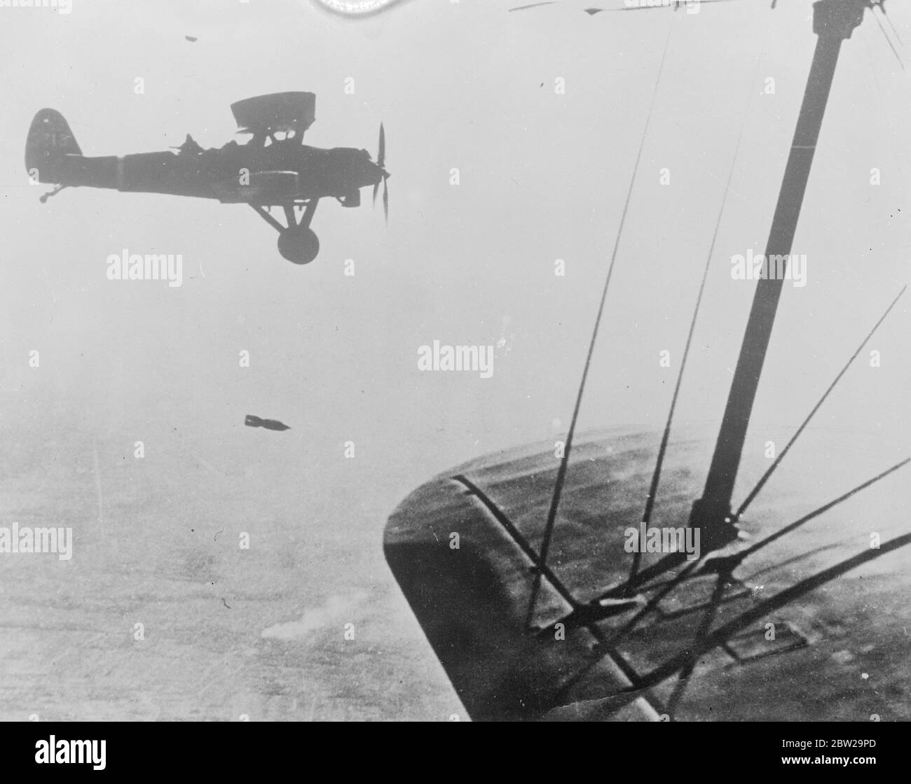 A Japanese bomb starts its deadly mission. This remarkable picture shows a bomb immediately after its release froma Kaga B3YI Japanese naval bombing plane. The camera caught the deadly missile as it was nosing downward to the Chinese lines near Shanghai. 22 November 1937 Stock Photo