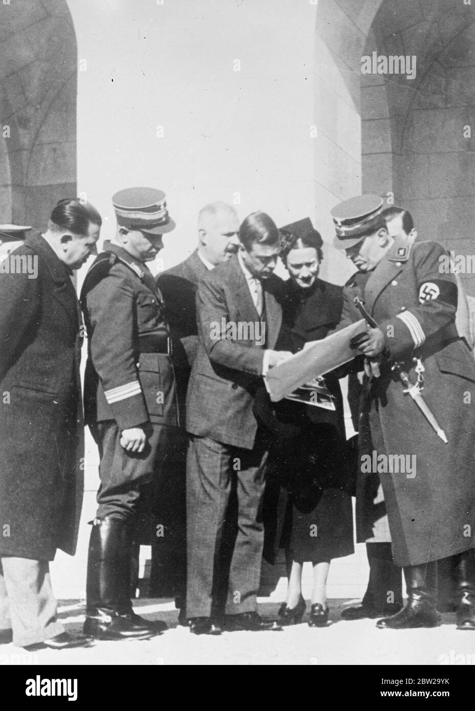 Duke and Duchess of Windsor in Nuremberg. Continuing their German tour, the Duke and Duchess of Windsor, visited Nuremberg, scene of the annual Nazi party congress, where they spent a busy day. Their inspection included new Nazi Congress buildings. Photo shows, the Duke and Duchess of Windsor, studying a plan with Chief Burgomaster Liebel (right) at Nuremberg. 21 October 1937 Stock Photo