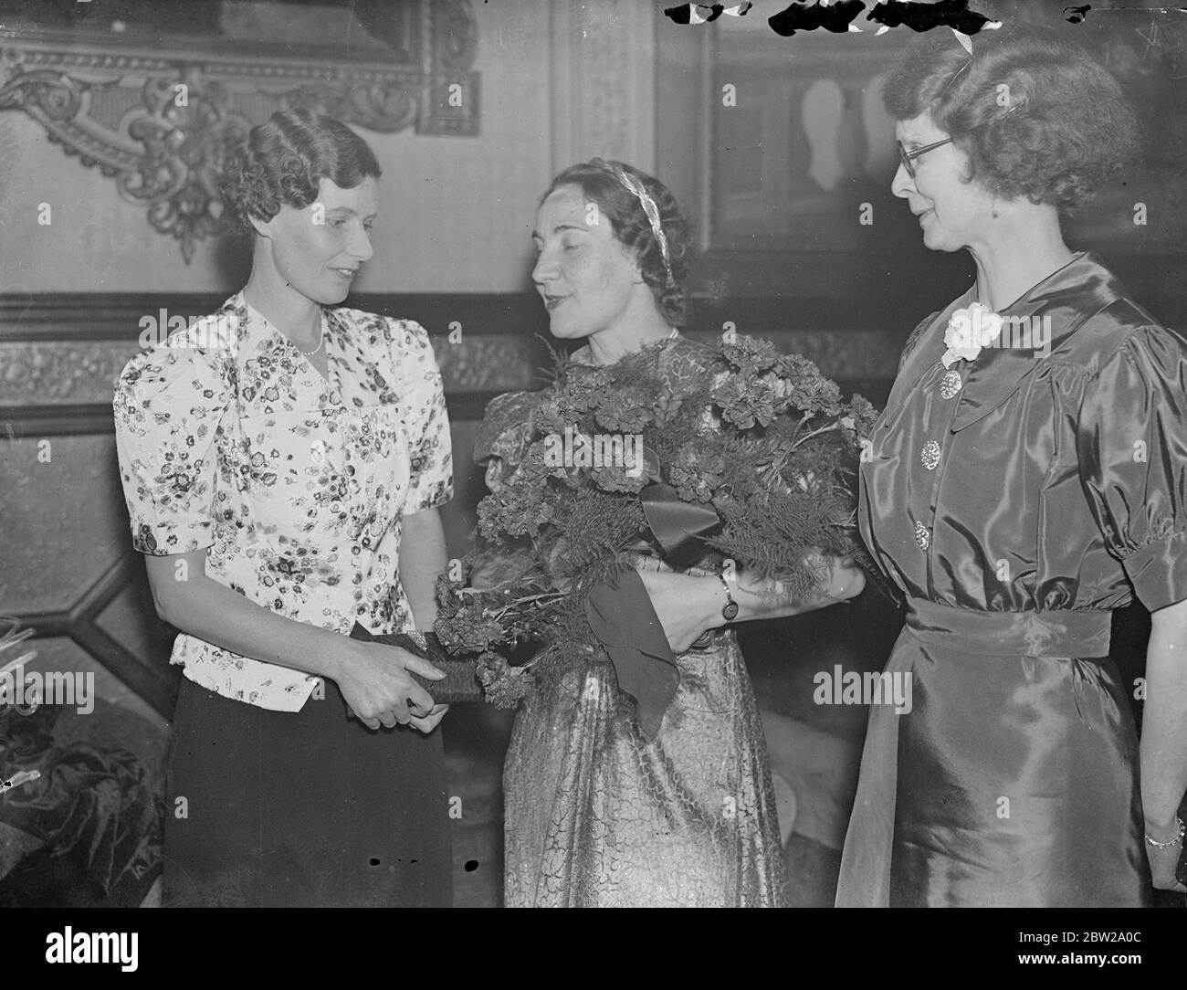 London dinner to celebrate 20th anniversary of the USSR. Celebrating the 20th anniversary of the revolution, the Anglo Russian Parliamentary Committee and the London Trades Council gave a dinner at the First Avenue Restaurant, Holborn, with M Maisky, Soviet Ambassador, as the chief guest. Photo shows, Mrs Attlee (left) Madame Maisky, wife of Soviet Ambassador and Mrs A M Wall, wife of the secretary of the London trades Council, (right), at the dinner. 23 November 1937 Stock Photo