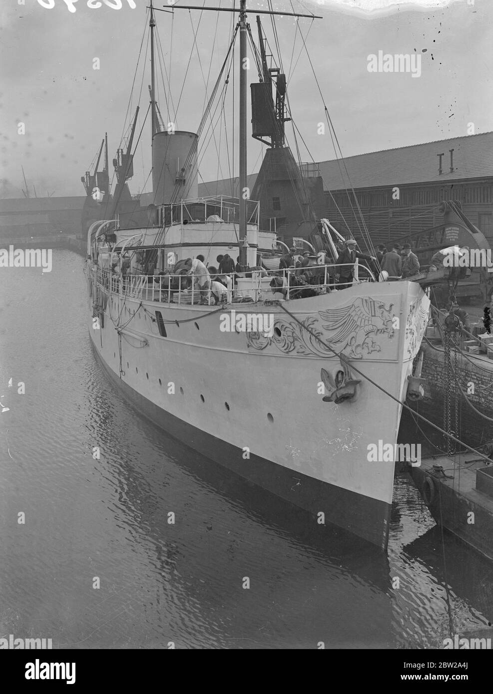 Duke's luxury yacht being turned into cable laying gunboat at Southampton. The 'Sons Peur', once the cheek of Sutherlands magnificent steam yacht, is being converted into a cable laying and river gunboat for the Government of Iraq at Southampton. Photo shows a general view of the 'Sans Peur' with men at work on her deck at Southampton. 16 October 1937 Stock Photo