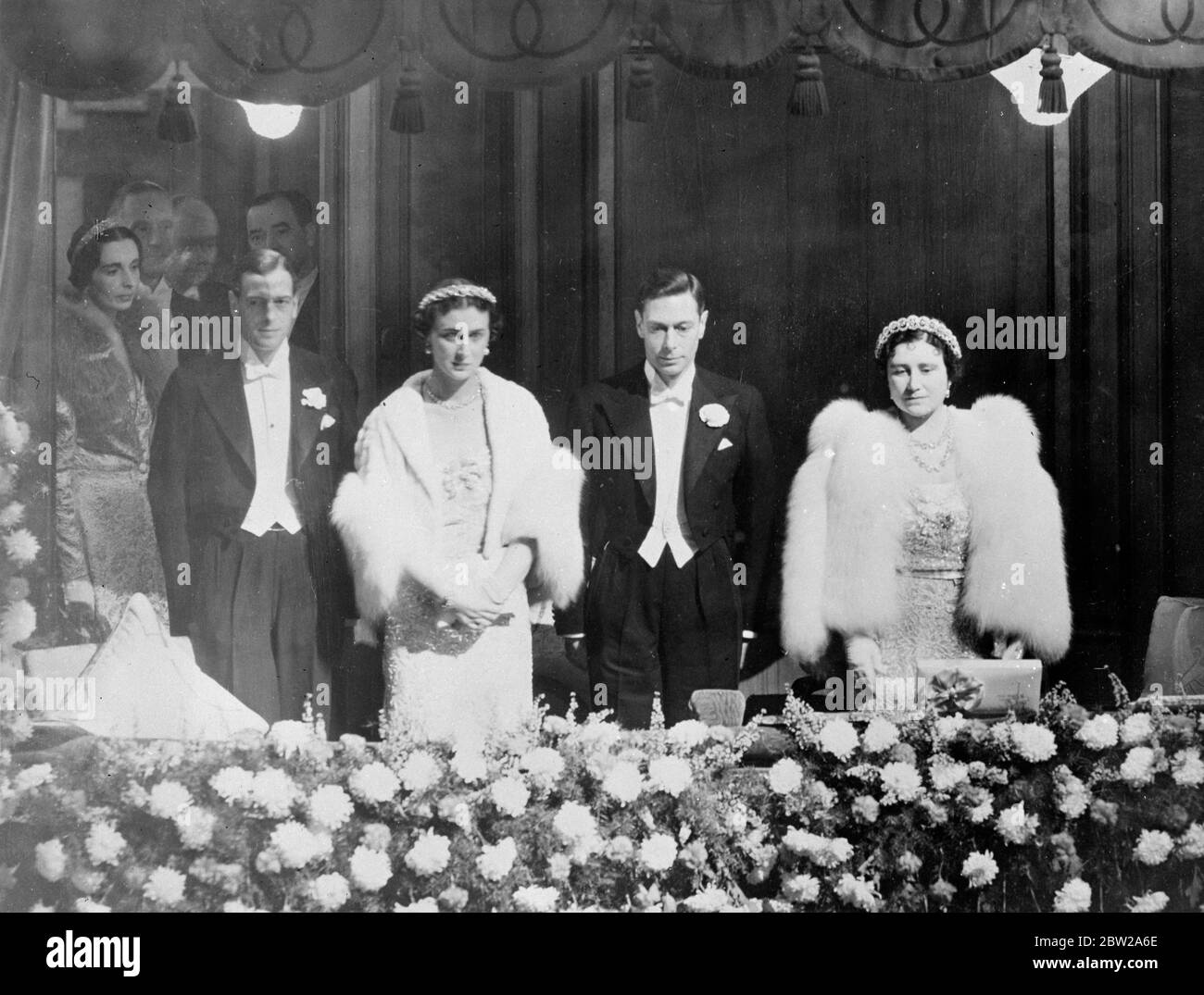 King and Queen attends Royal Command Performance at Palladium. The King and Queen attended the Royal Command Variety Performance in aid of the Variety Artist Benevolent Fund at the Palladium, Argyle Street, London. Photo shows, the King and Queen, with the Duke and Duchess of Kent, standing in the Royal box during the national anthem. 15 November 1937 Stock Photo