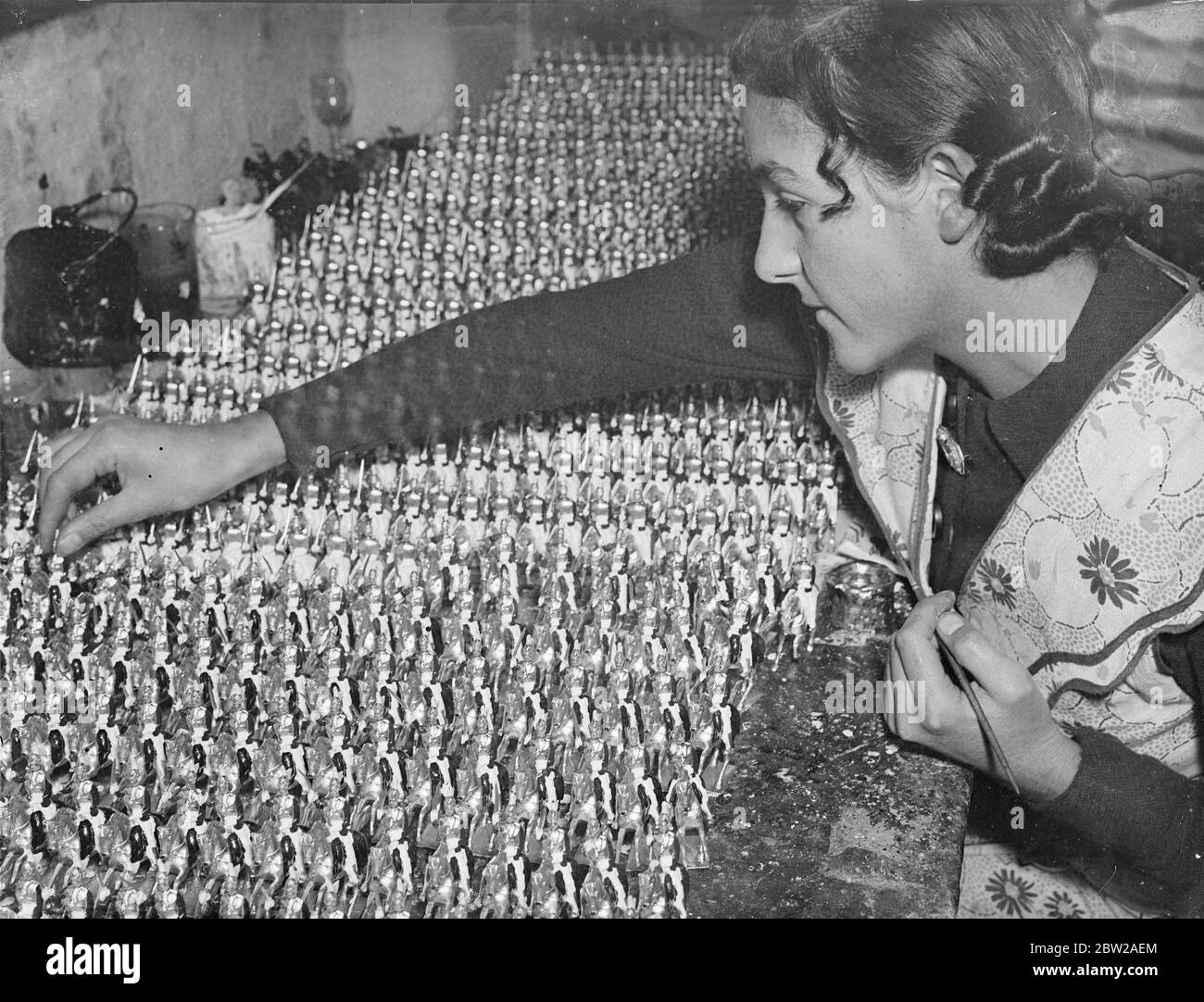 The Life Guards take the field for Christmas. An 'army'of Life Guards ready to march into the Christmas shop windows from a factory in Hornsey, Rise, London. This year, there is an unprecedented demand for toy soldiers, perhaps as a result of the governments recruiting campaign and factories are working at full pressure. 23 November 1937 Stock Photo