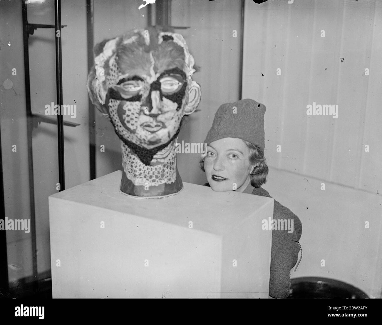 Works classified as found objects, interpreted objects, perturbed objects and constructed objects are on show at the Surrealist Exhibition opening at the London Gallery in Cork Street, Piccadilly. Photo shows, Miss Eileen Agar with her Surrealist model 'Angel of Anarchy' 23 November 1937 Stock Photo