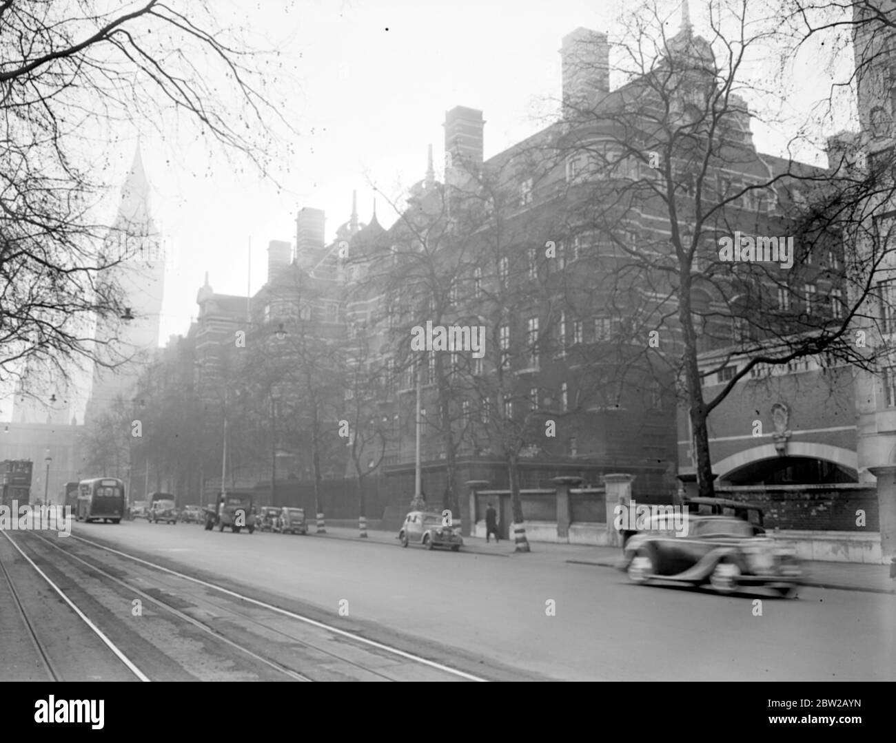 The Norman Shaw Buildings (formerly known as New Scotland Yard), Victoria Embankment. Parliament and Big Ben tower in the background. [No original caption, date] 1930s, 1940s Stock Photo