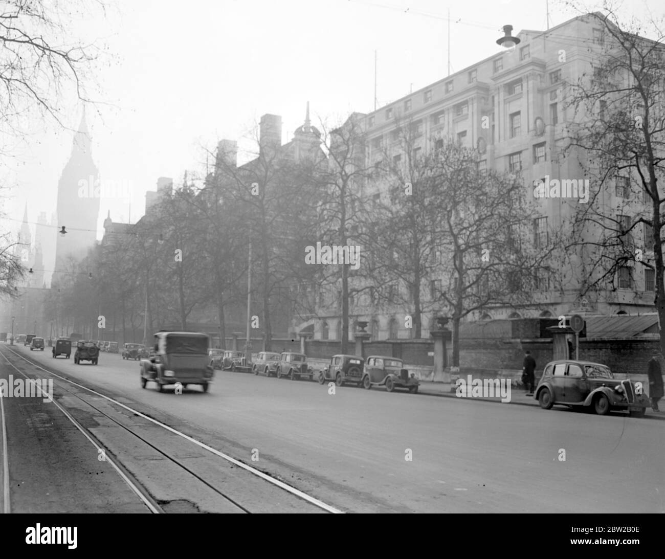 Victoria Embankment, the Ministry of Defence building with the Norman Shaw Buildings, Parliament and Big Ben tower in the background. [No original caption, date] 1930s, 1940s Stock Photo