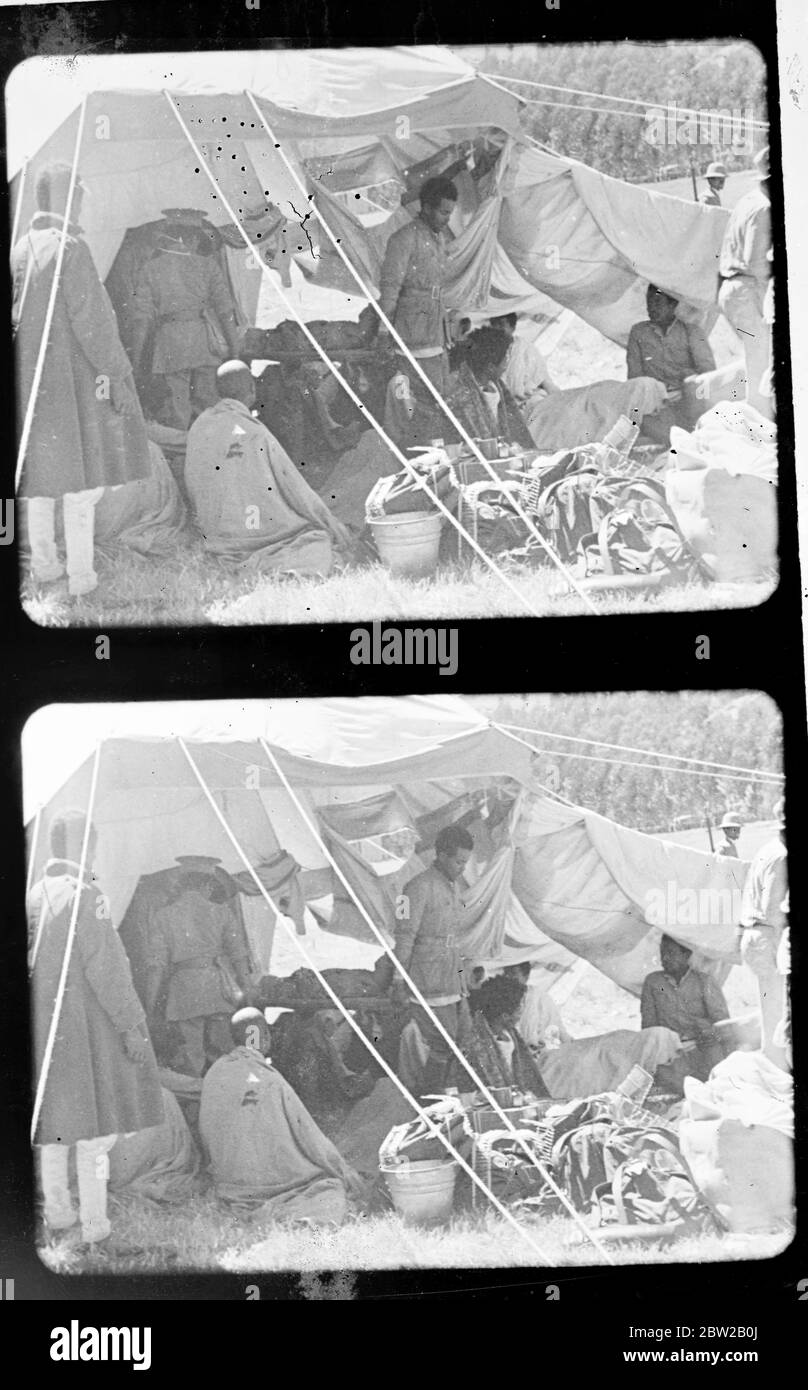 Dessie / Dese / Dessye was first bombed 6 December 1935, during the Italian invasion of Abyssinia. The American Hospital was one of the buildings damaged in the attack [first aid point, tent, hospital, man on a stretcher] 6 December 1935 abyssinian / ethiopian crisis Stock Photo
