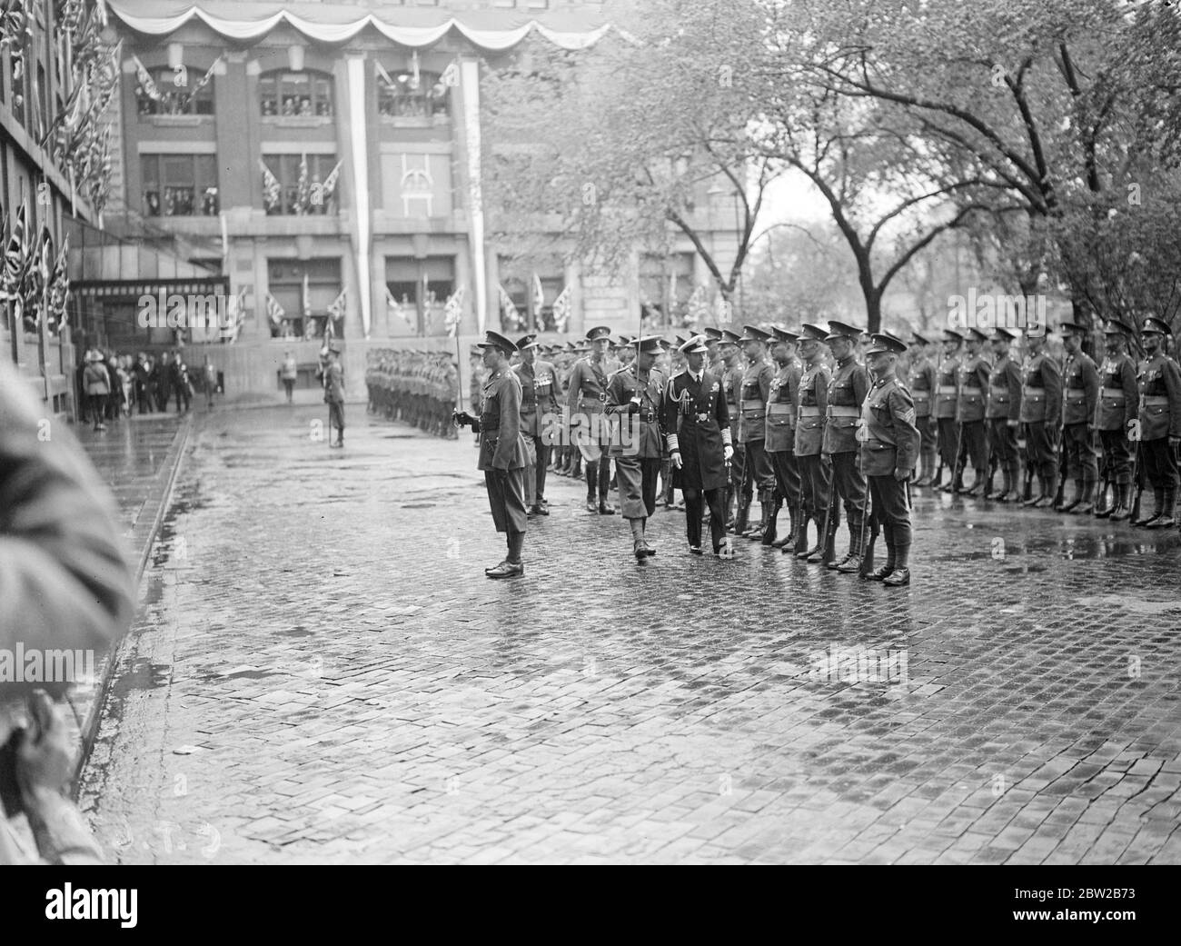 The Royal visit to Canada. King inspects Guard of Honour on arrival at Winnipeg during the Million Dollar Shower [the pressed dubbed the crop saving rain on Wednesday / Million Dollar Rain] 10 May 1939 ? Stock Photo