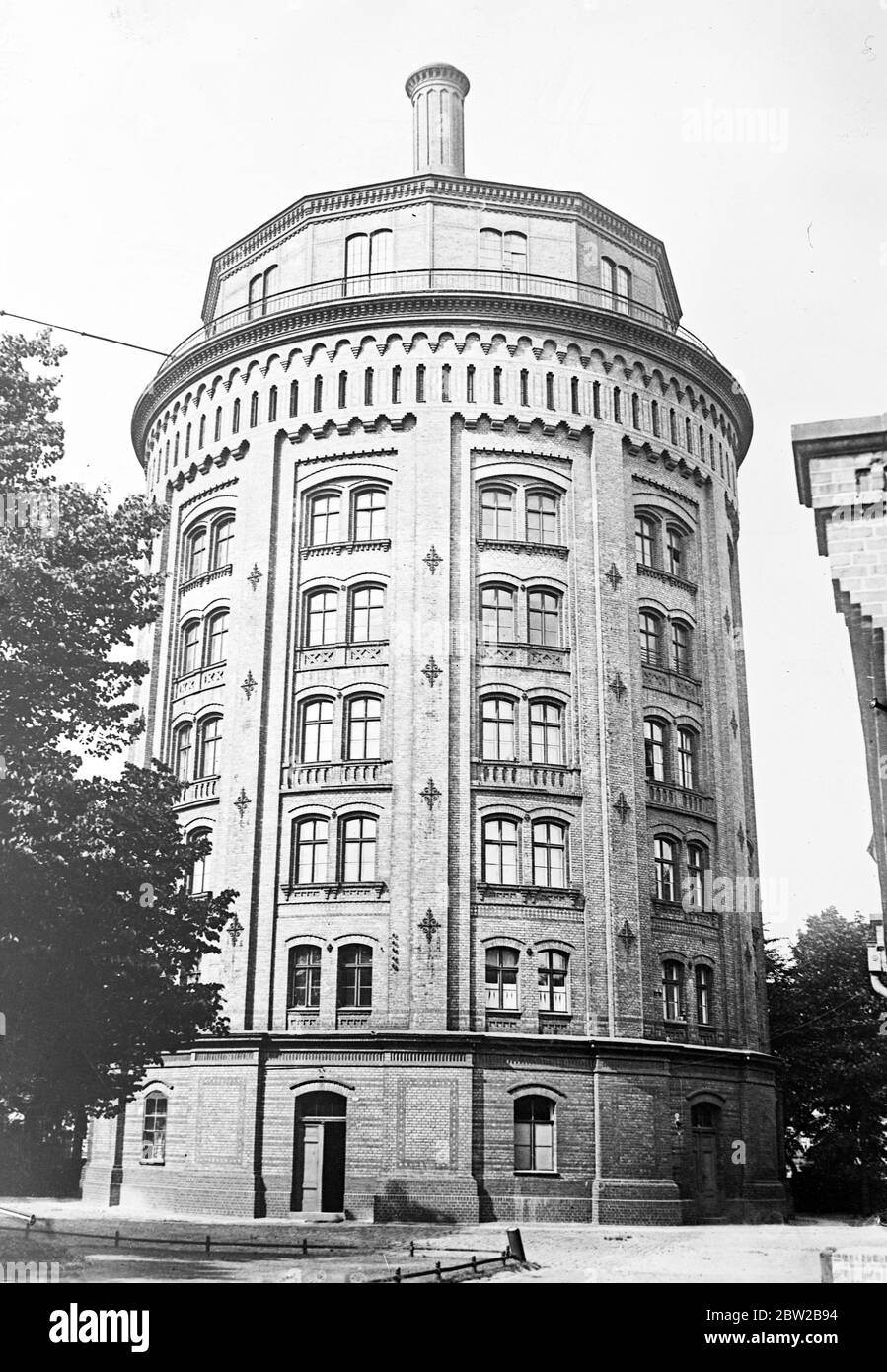 Novel apartment house. A distinguish water tower in Berlin, which has been most satisfactorily adapted as flats for working people. Each flat is lit by electric light, and has an admirable water supply. Owing to the house shortage in Germany, many disused buildings are being adapted in this fashion. 7 September 1929 Stock Photo