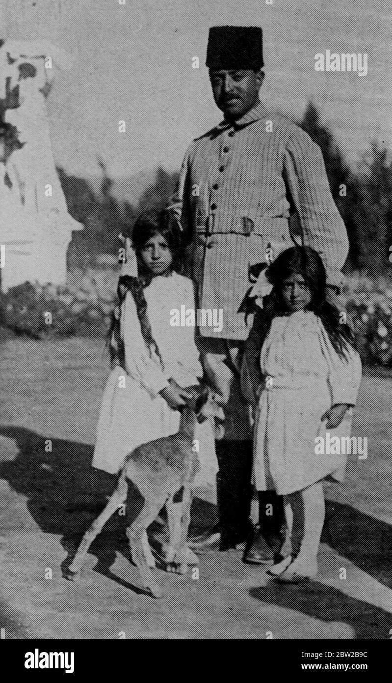 The Amir of Afghanistan, photographed with his two daughters. 12 March 1928 Stock Photo