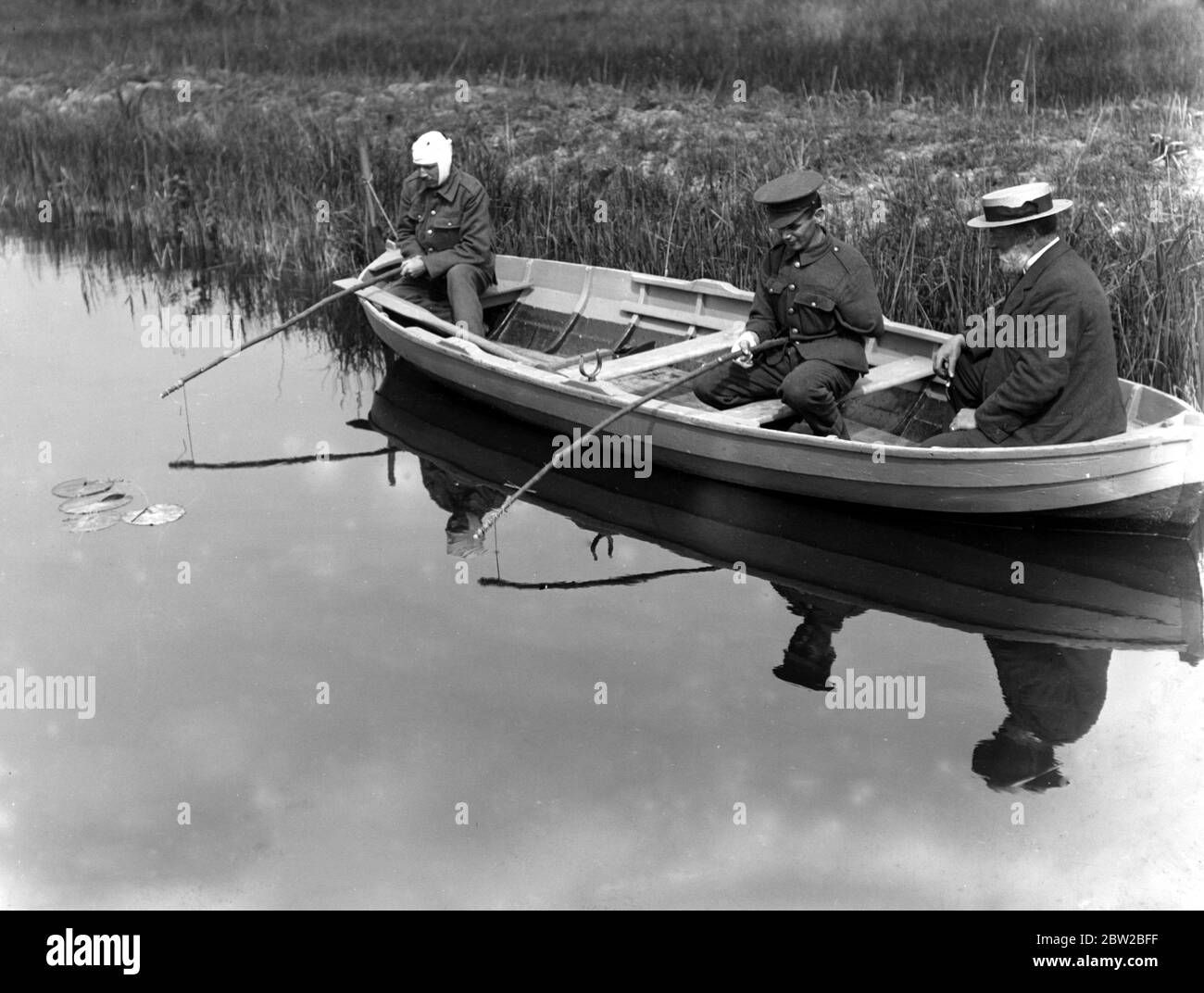 Convalescent soldiers fishing on the Norfolk Broads. 1914-1918 Stock Photo