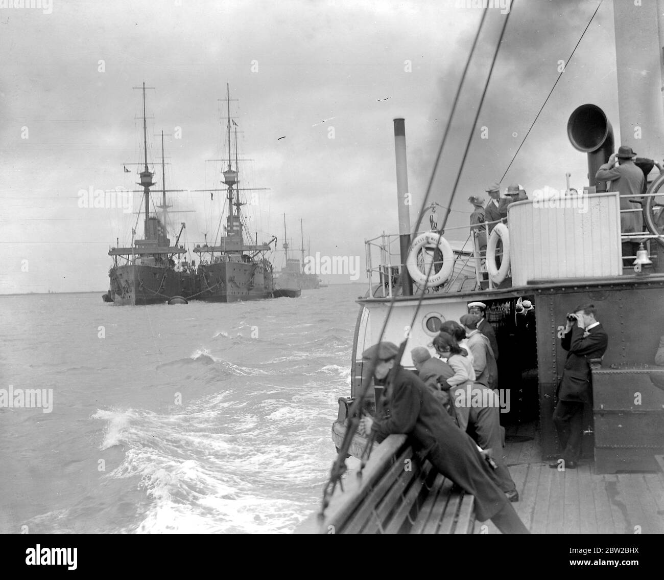 Naval Mobilisation at Sheerness as the steamship the Princess of Wales steams passed the drawn up ships. 1914 Stock Photo