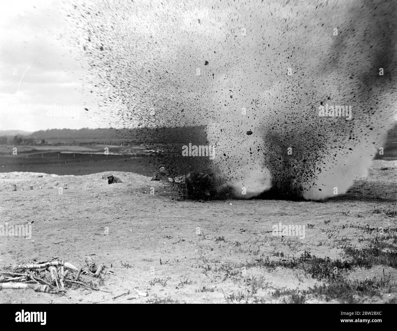 Training dogs at the War Dog's Training School at Lyndhurst. Dog jumps past explosion 26 April 1919 Stock Photo