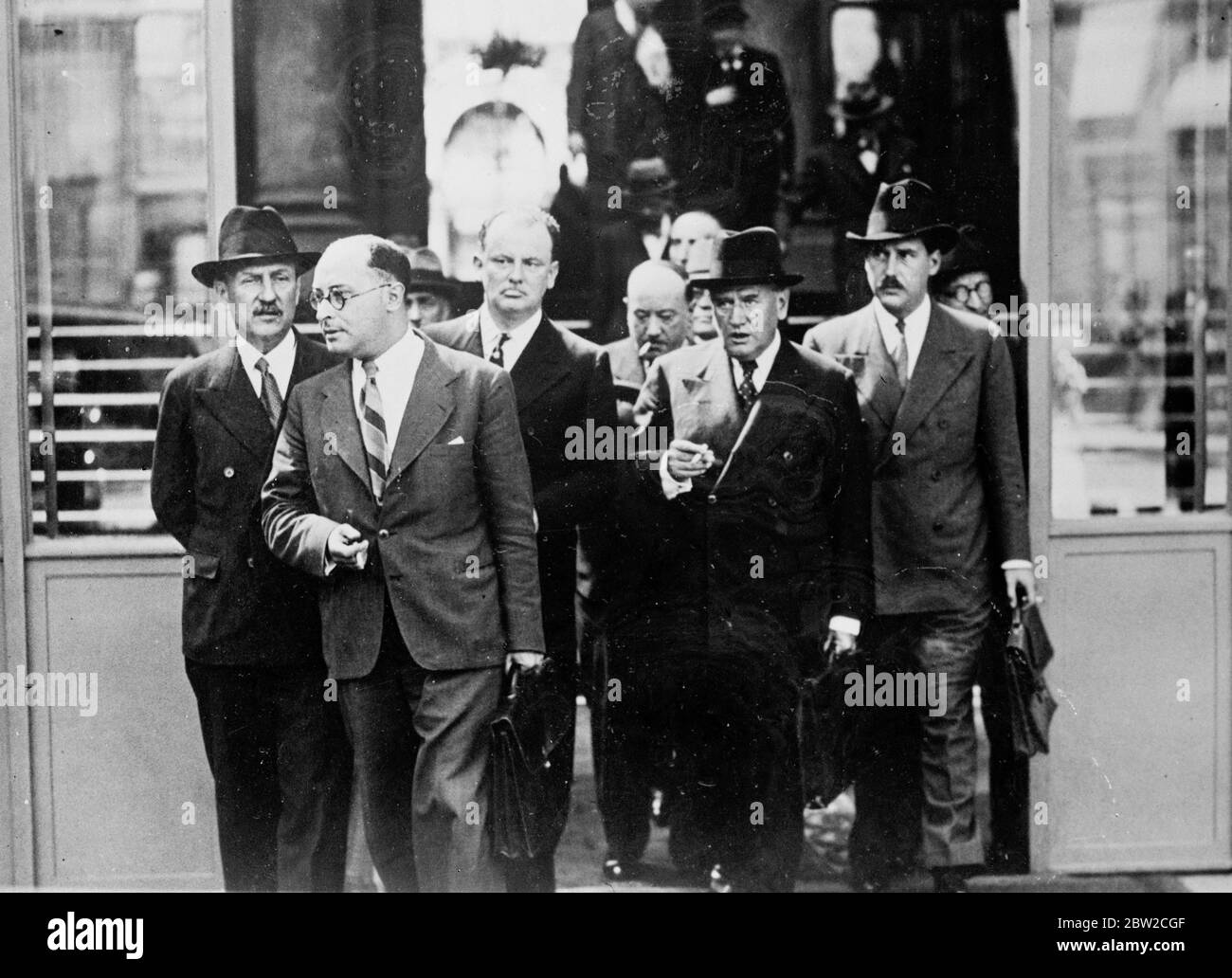 The French cabinet met by the Elysee Palace in Paris under the presidentcy of President Albert Lebrun to consider the serious situation brought about by Germany's attack on Poland. The ministers decided to order general, mobilisation. Photo shows Mr Edouard Daladier (second from right) wearing a grave expression as he left with the Ministers after the meeting - left-to-right- Mr Camille Chautemps, Vice Premier; Mr Jean Zay, education; Mr Pomaret; Mr Alfred Jules Julien, Posts and Telegraphs; Mr Edouard Daladier; and Mr Guy La Chambre, Air. 2 September 1939 Stock Photo