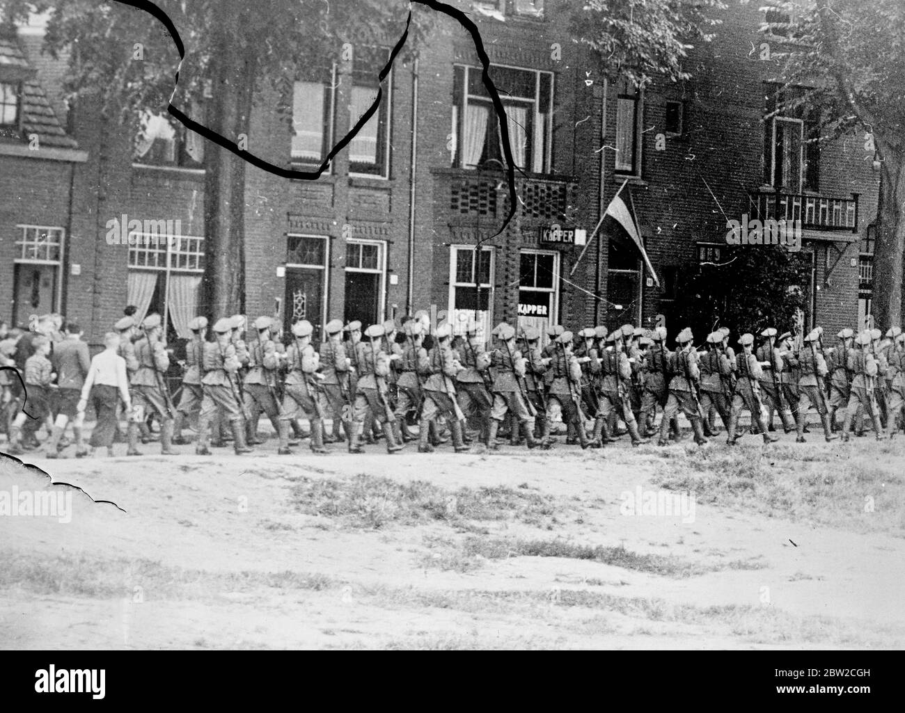 Holland mobilised to protect neutrality. In a Europe in which hostilities have already broken out, all Holland's forces are mobilised for the purpose of ensuring the country's neutrality in a general conflict. Troops followed by town folk as they marched through Nijmegen, a Dutch border town lying between the Rhine and Germany and scarcely a mile from German territory. 2 September 1939 Stock Photo