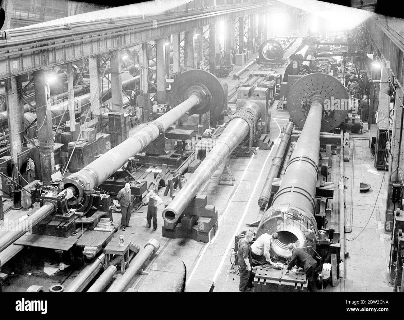 Where Britain forges victory. This pictures were taken in a Royal Ordinance factory of the Ministry of Supply where, thousands of workers are producing arms and ammunition which will help to ensure the victory of Britain and her Allies. Photo shows a general view of the big guns shop. 13 November 1939 Stock Photo