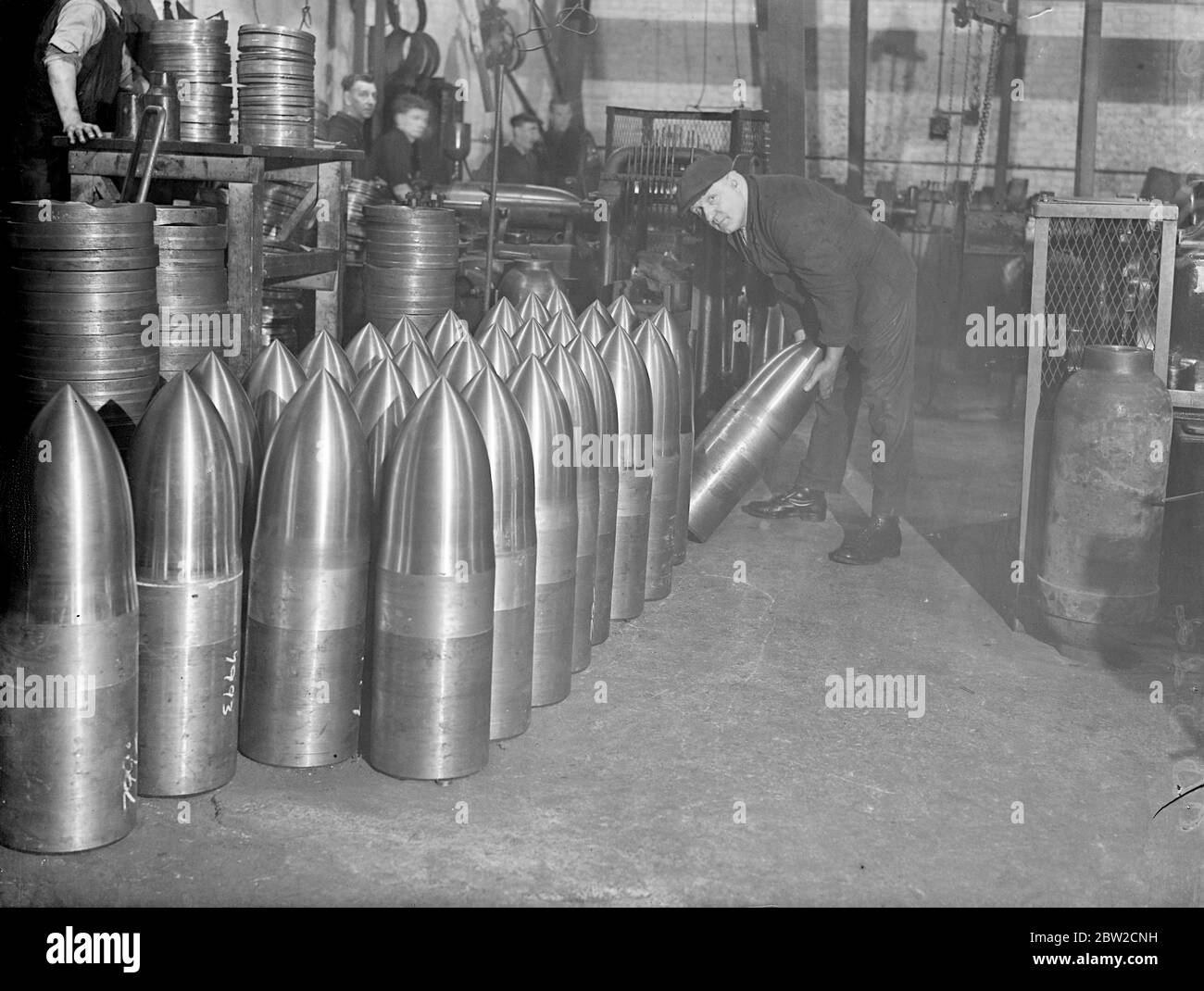 Rows of the shells made at a British shell factory - one of Europe's largest - somewhere in England, where men are working day and night to fulfil orders for the Ministry of Supply. 18 November 1939 Stock Photo