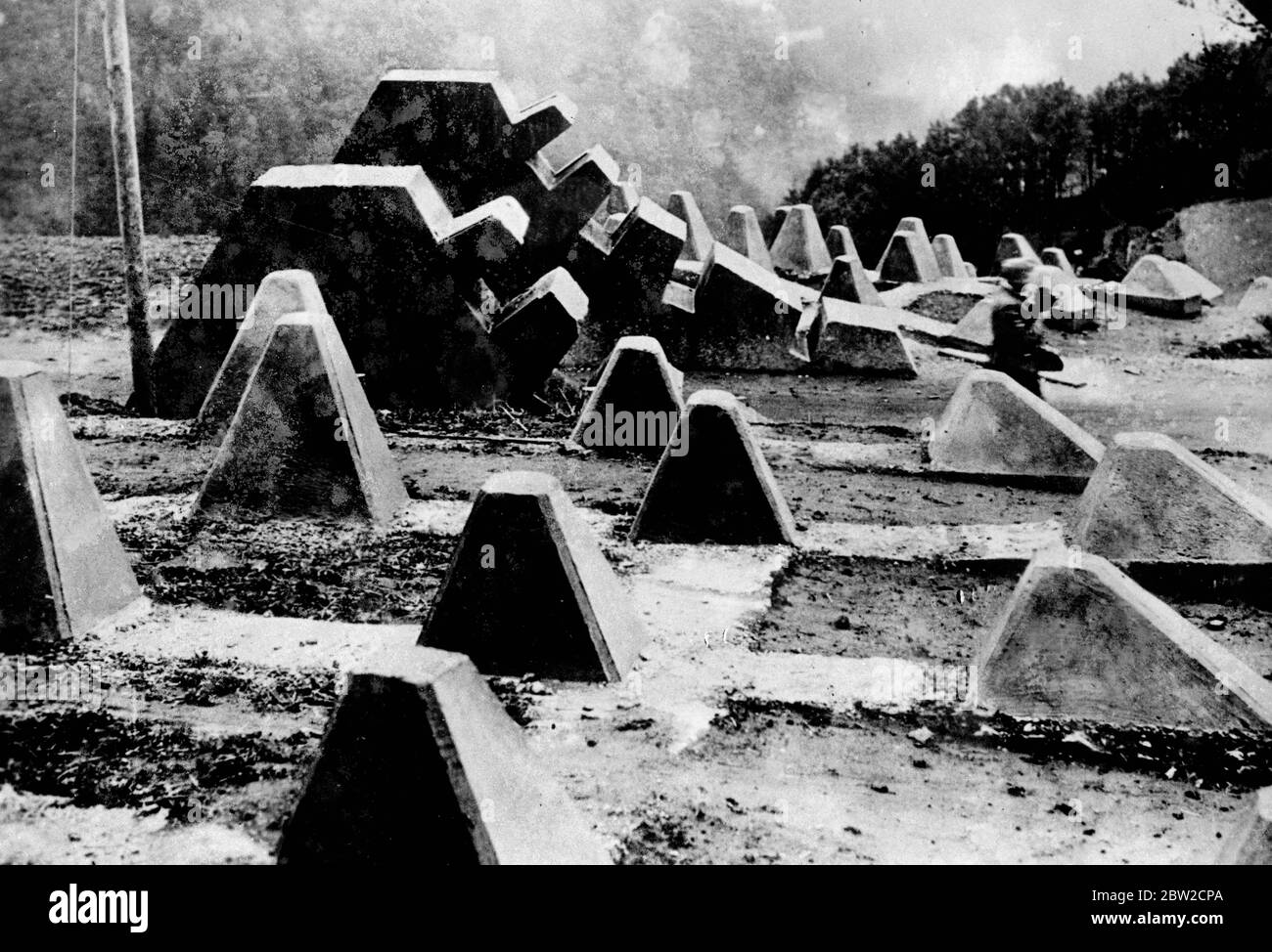 Reinforced concrete ramparts, like giant's teeth, that form tank traps on Germany's western frontier that marches with France. Traps like these spread the length of the Siegfried Line. 21 August 1939 Stock Photo