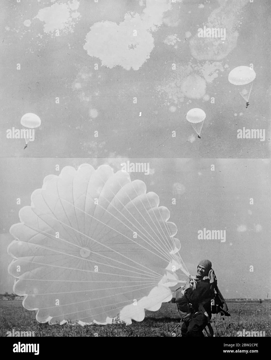 D. Tshavro, an amateur parachutist, laughs with enthusiast's delight as he beats his colleagues to earth after a group parachute jump at the V. Tshaklov Central Sierra Club, Moscow. 19 June 1939 Stock Photo