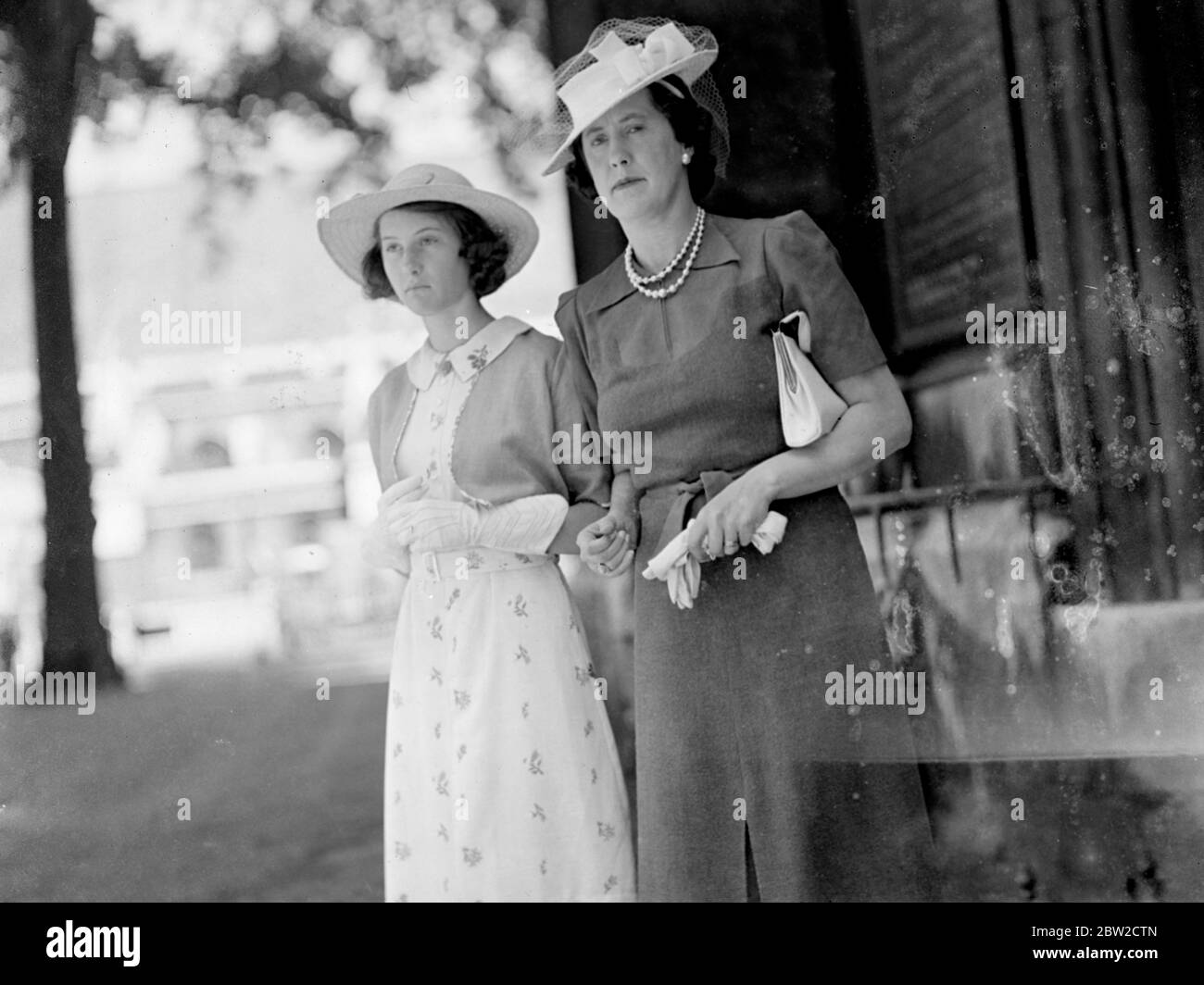 Cool headgear worn by the Marchioness of Cambridge and her daughter, Lady Mary Cambridge, when they take a walk in the West End. 1 July 1939 Stock Photo