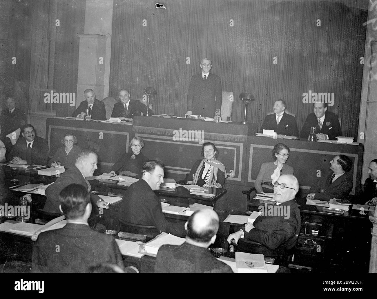 The governing body of the International Labour Office is meeting for the first time in London to hold its 85th session at Burlington House, Piccadilly. The body consists of three groups comprising representatives of 15 governments and eight representative each of employers and workers organisation. The British Minister of Labour, Mr Ernest Brown, attended. Photo shows: The opening meeting under the chairmanship of Mr F W Leggatt, Chief of the Industrial Relations Department of the Ministry of Labour. Left is Sir Thomas Phillips, Permanent Secretary at the Ministry Of Labour. On the right are M Stock Photo