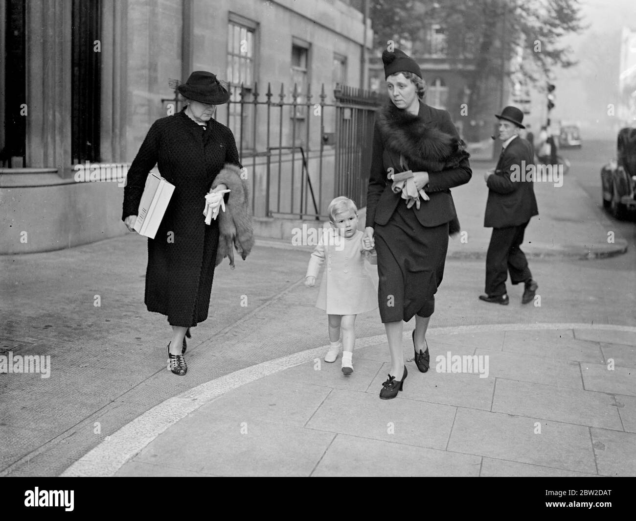 Lance, the baby son of Count and Countess Haugwitz-Reventlow, visited his mother, the former Barbara Hutton, Woolworth heiress, in the London nursing home where she is recuperating after a dental operation. Lance is considered to be the world's richest baby. Photo shows: Lance leaving the nursing home in London after visiting his mother. 20 October 1938 Stock Photo