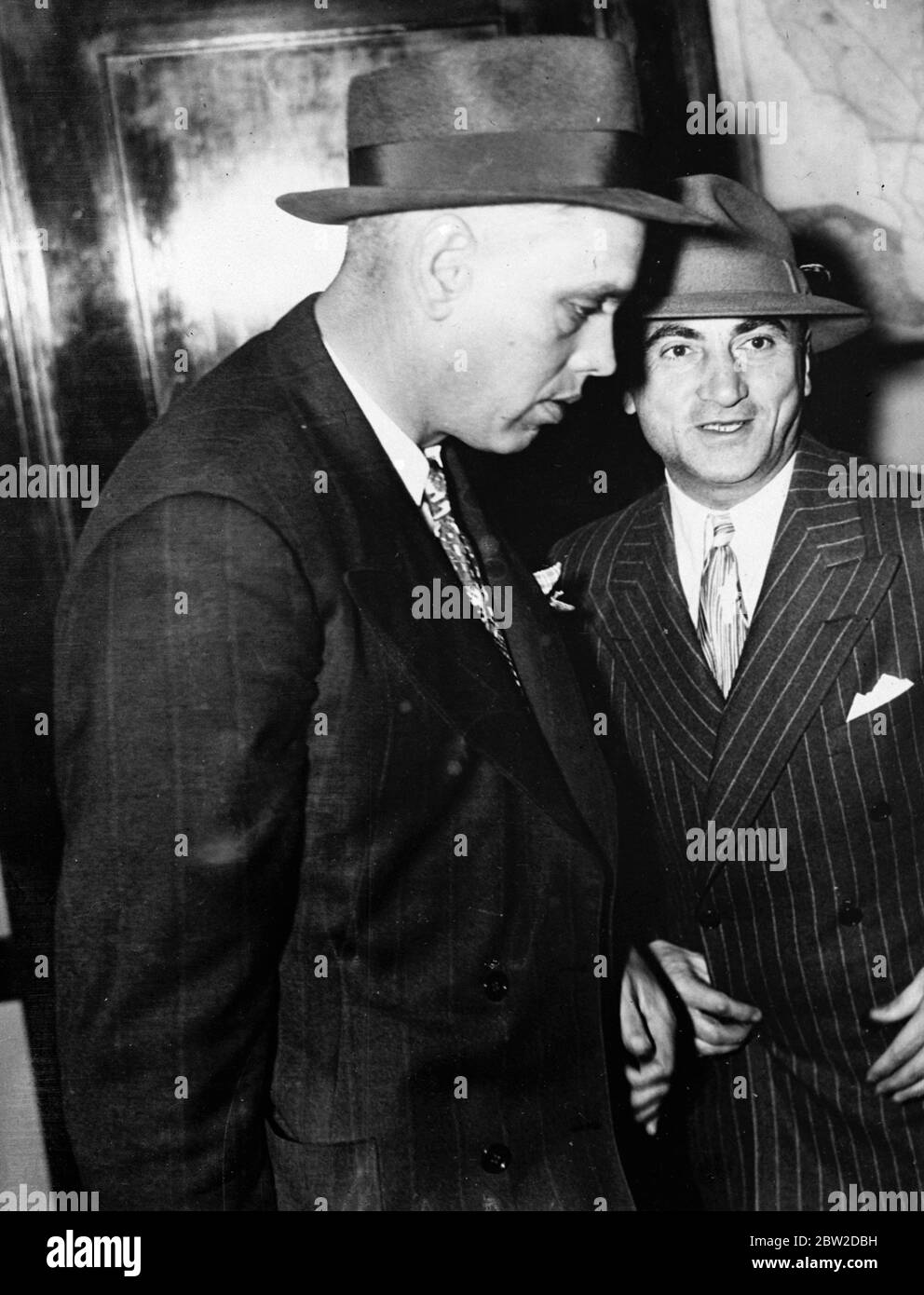 Martin (Moe) Snyder, divorced husband of Miss Etting, the retired stage, radio and film singer, was arrested in connection with with this shooting of Mr Alderman, Miss Etting's present husband, who was taken to hospital.. Photo shows: Martin smiling at Hollywood police station after his arrest. 24 October 1938 Stock Photo