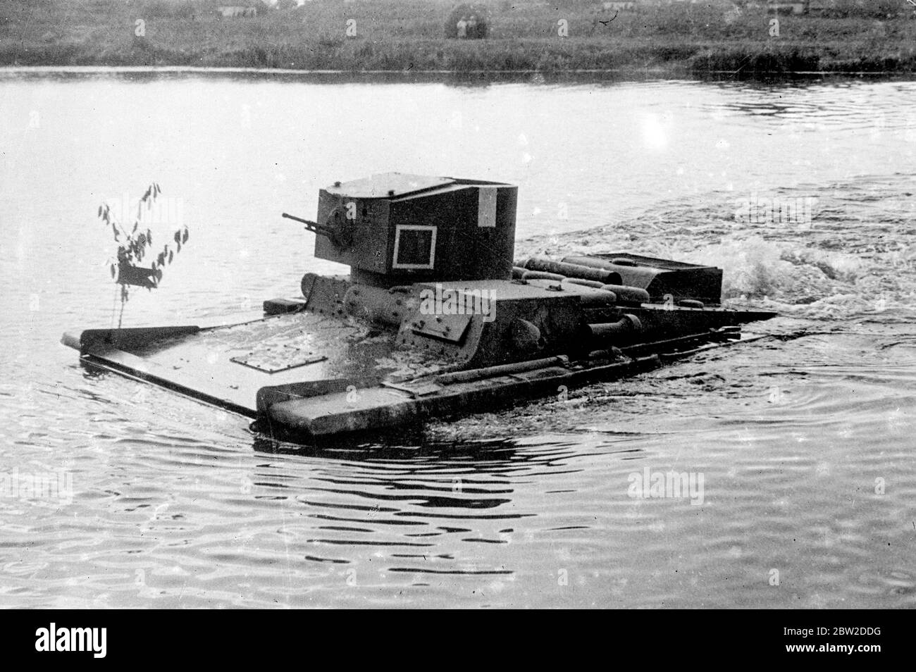 One of the novelties of the Red Army is the heavy amphibious tanks which appeared to be quite as at home on a stretch of water as they are when crossing the roughest country. Photo shows: And amphibian tank of the Soviet army foraging the river during tactical exercises. 23 October 1938 Stock Photo