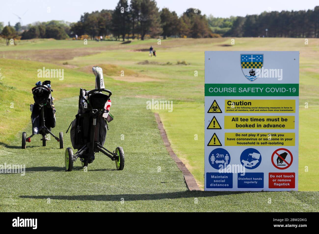 Troon, UK. 29th May, 2020. After weeks of lockdown because of covid-19, Barassie Links and Hillhouse course, both part of Kilmarnock (Barassie) Golf Club, Troon, opened today with the first tee off time at 7.30am. Both courses were fully booked, with all players adhering to the guidelines, keeping 2 metres apart, not touching the flag and the cups upturned so that the ball doesn't need to be removed from the hole. Credit: Findlay/Alamy Live News Stock Photo