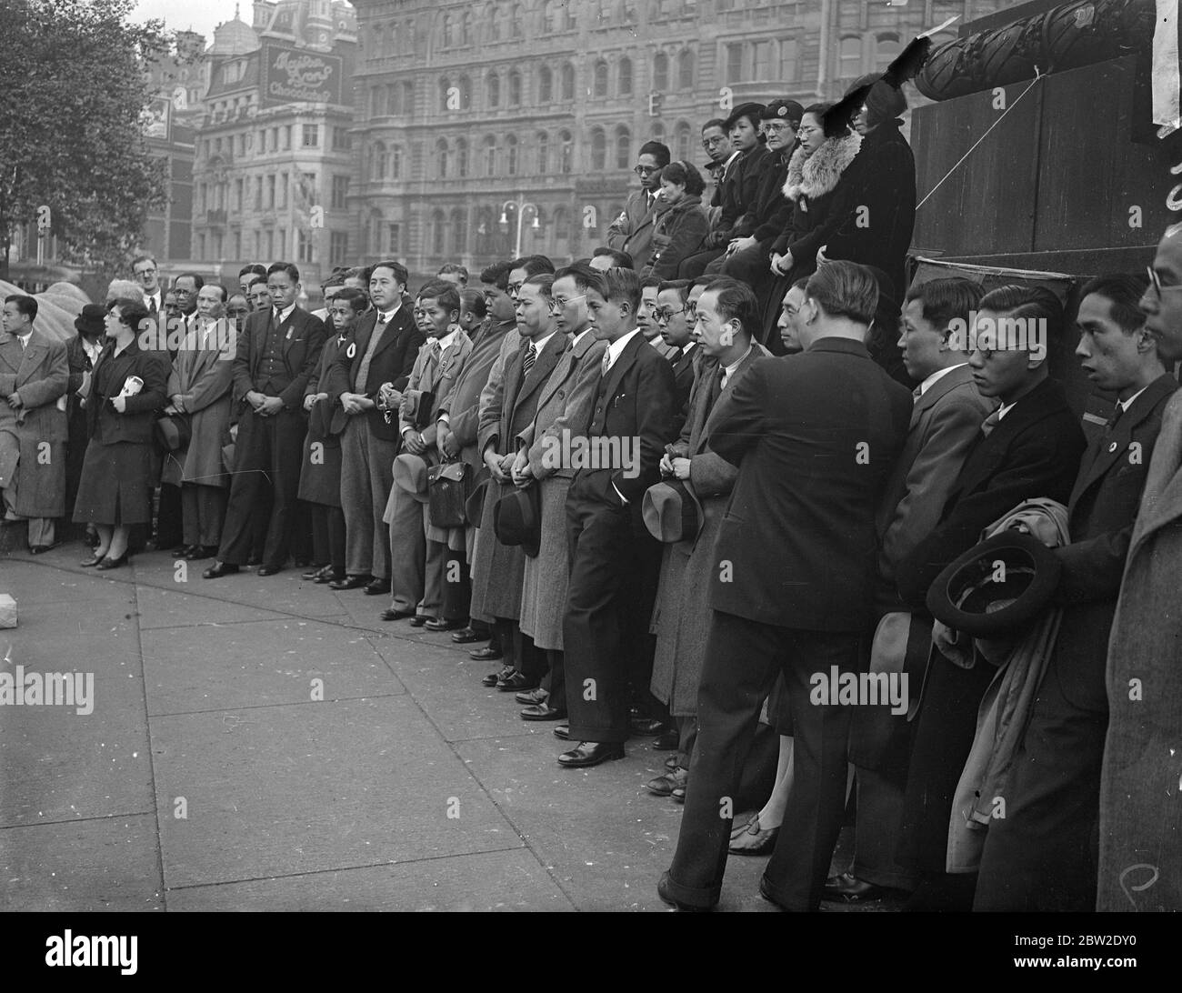 Several Chinese were among the speakers are members of London's Chinese colony formed part of the audience at a great mass meeting held in Trafalgar Square, London to protest against Japanese attacks on civilians in China. Chinese listening to the speakers in Trafalgar Square. 10 October 1937. Stock Photo