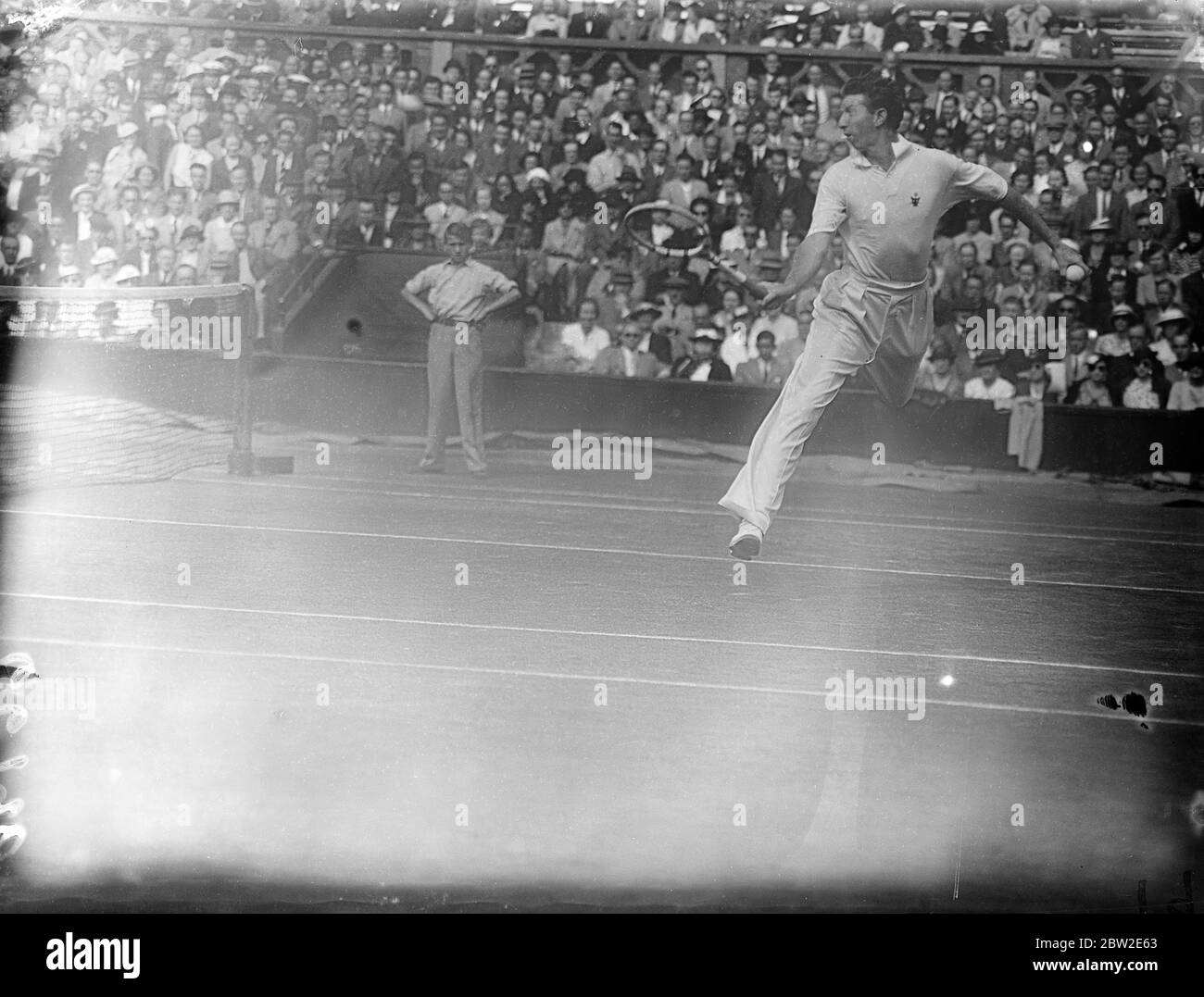 Donald Budge in play. Hare beat Budge to become Wimbledon champion winning 13-15 in their singles match in the Davis cup challenge round at Wimbledon. 24 July 1937 Stock Photo