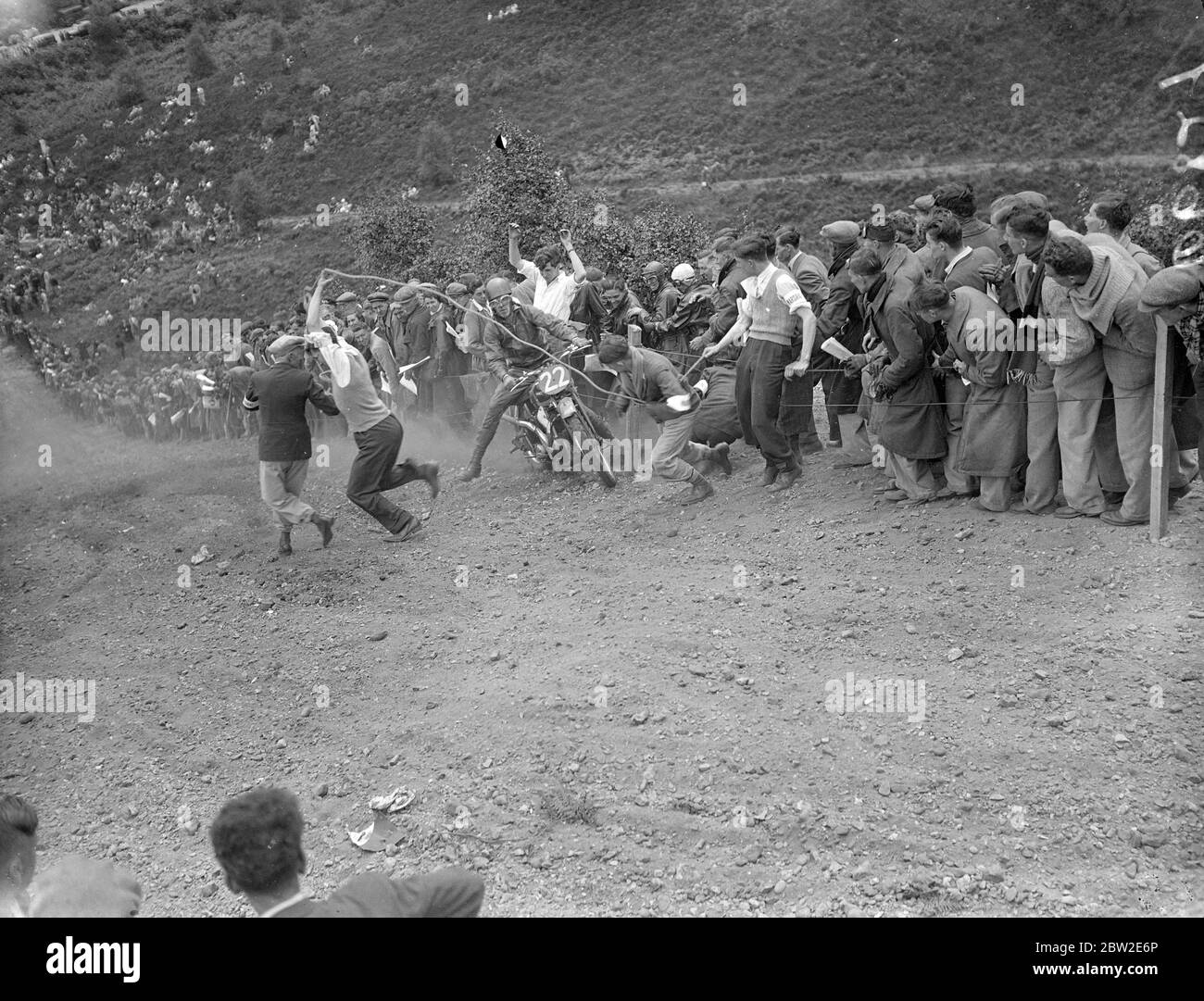 The wilde scramble as all CH Bradley, riding an aerial, charged the crowd on red Road during wilde scramble of the Bayswater motorcycle club lived up to its name when several riders, in a flurry of dust, got out of control at a steep trial Hill and charged the crowd-fortunately without injury. 25 July 1937 Stock Photo