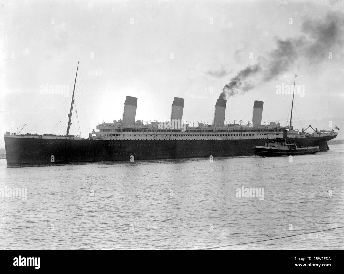 The Cunard White Star Olympic in dock at Southampton, after 24 years service here to be boken up, and leaving for Rosyth. 22 August 1935 Stock Photo