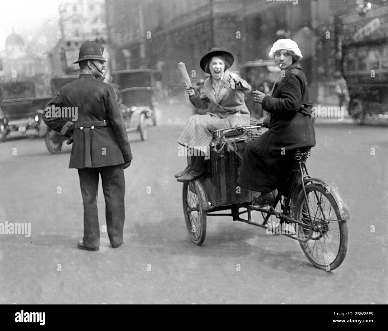 The girl cycle rider enjoys a cigarette. 1914 Stock Photo