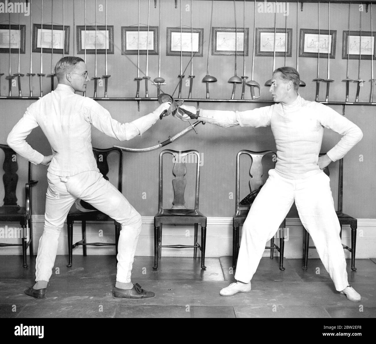 Prince Olaf of Norway (right) taking part in the Oxford V Royal Navy fencing Tournament at Capt Filex Grave's fencing school. 14 November 1924 Stock Photo