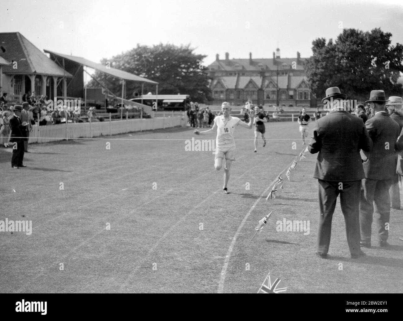 Crossing the line at a running event. 1934 Stock Photo