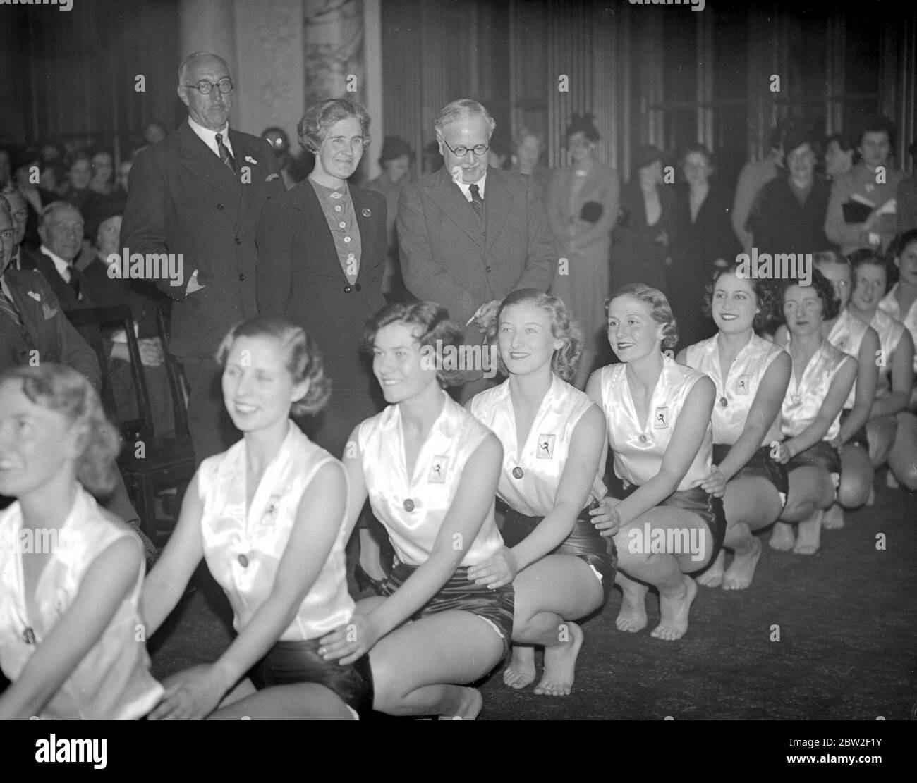 Sir Kingsley Wood (Minister of Health) , watches a demonstration by members of the women's league of health and beauty whe inaugurating a new branch at the Ministry of Health. 12 October 1937 Stock Photo