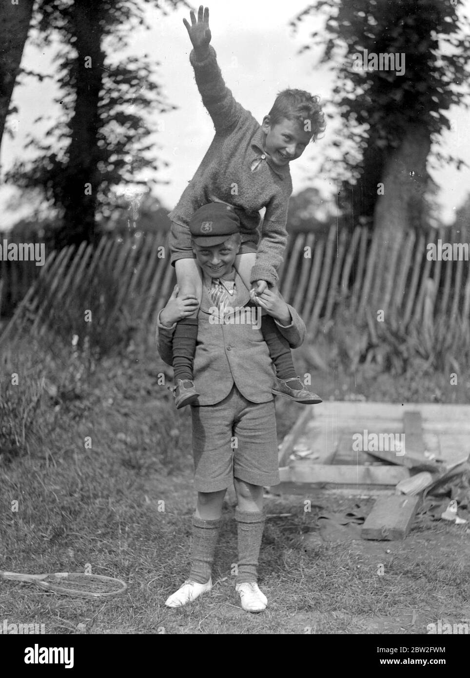 Boys playing piggy back. 1933 Stock Photo