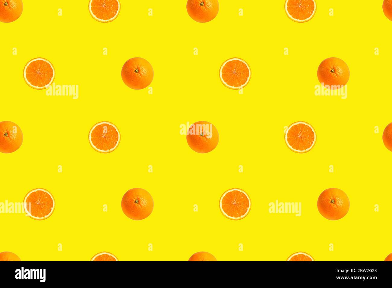 Oranges on bright yellow background seamless pattern. Stock Photo