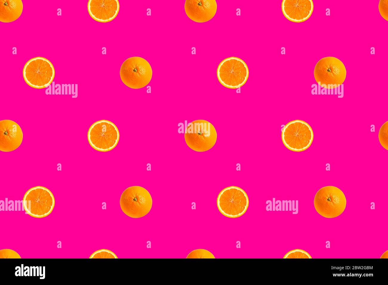 orange halves on bright pink background seamless pattern Stock Photo