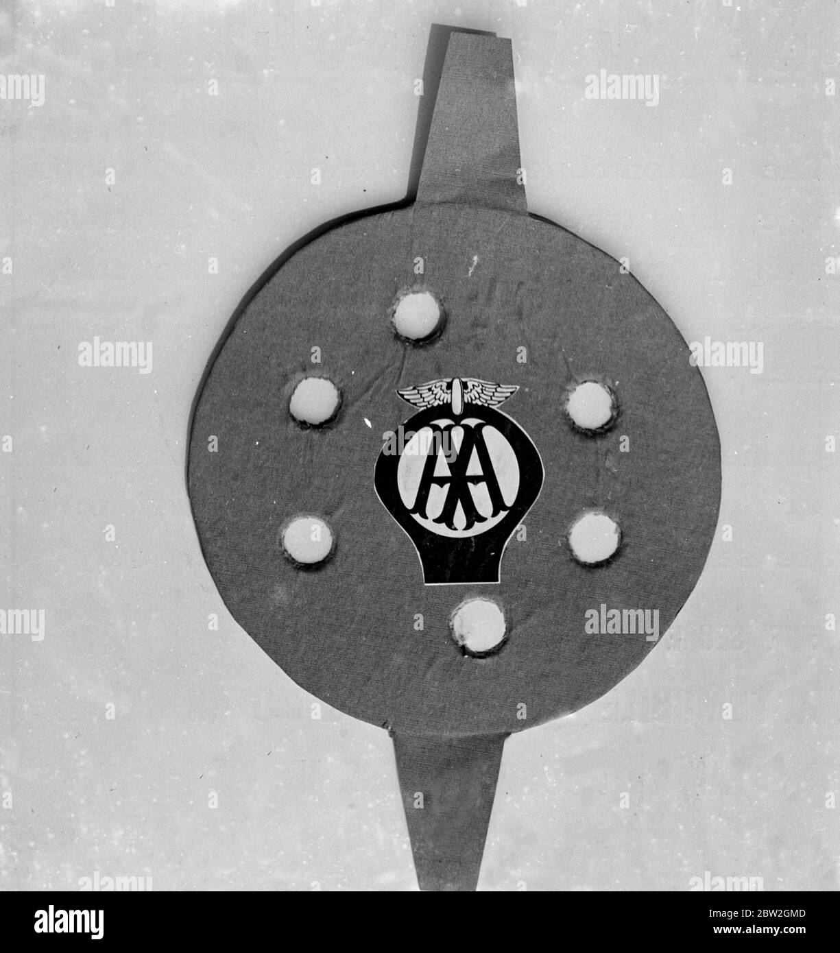 New lamp disc being manufactured for the automobile association and motor union for the use of motorists when entering the ares where by the new order such discs are compulsory. Stock Photo