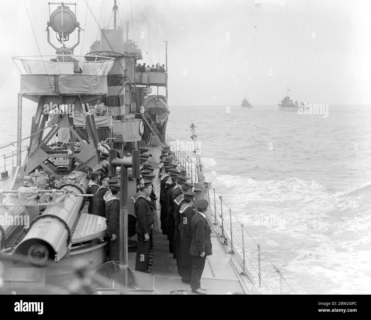 Home coming of Unknown Soldiers on H.M.S. Verdun on way home to England. Saluting the dead. After a 19-gun salute was fired from Dover Castle, she tied up at Admiralty Pier where General Sir John Longley supervised the six high ranking officers from the three Armed Services to bring ashore the coffin. Photo shows, home coming of Unknown Soldiers on H.M.S. Verdun on way home to England. 11 November 1920 Stock Photo