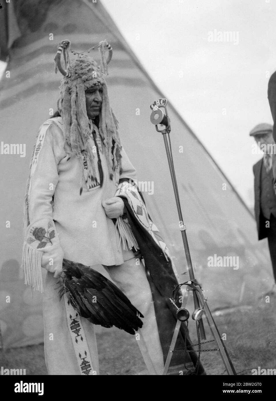 The Royal tour of Canada and the USA by King George VI and Queen Elizabeth , 1939 Indian Chief Percy Littledog at the microphone during the broadcast of the event when the King and Queen visited Calgary, Alberta , heart of the Canadian West. Stock Photo